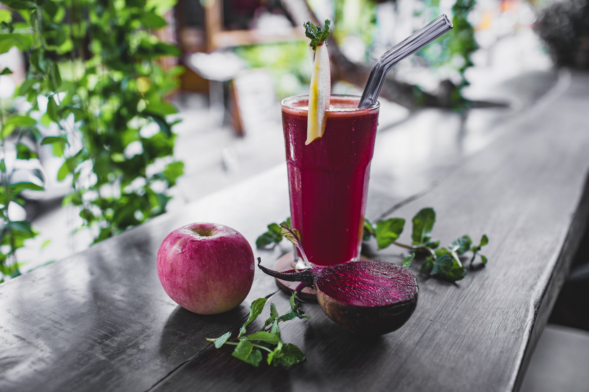 natural apple and beetroot smoothie served on table of resort cafe
